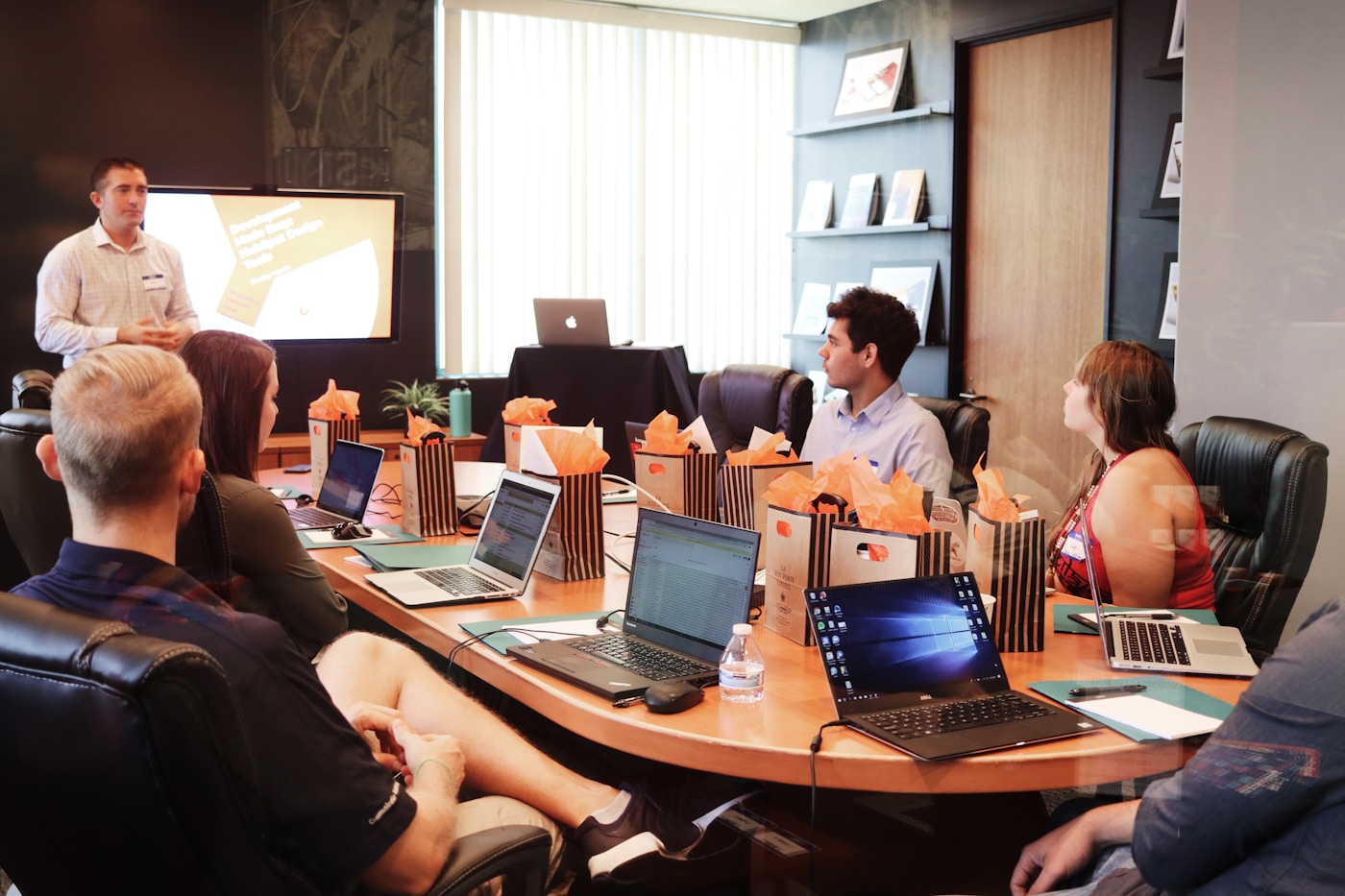 Business professionals reviewing information in a working meeting